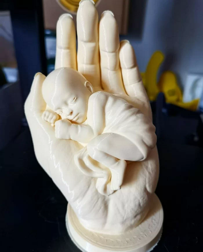 Hand and baby